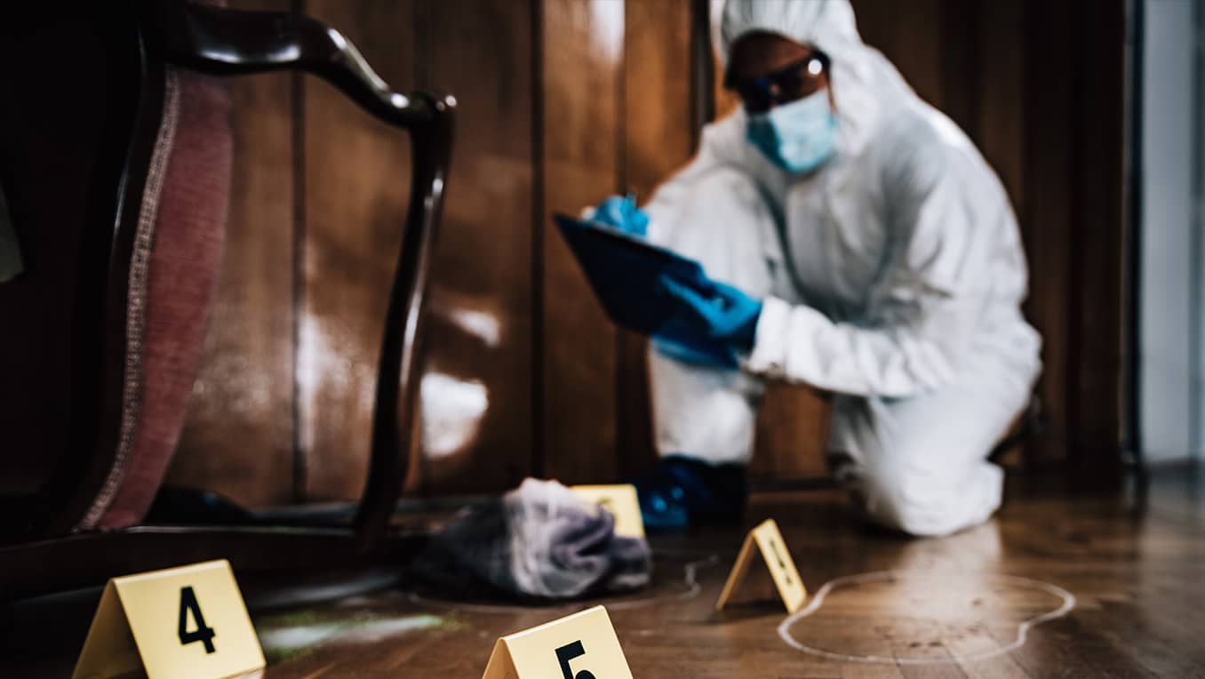 Detective in protective gear and mask, investigating crime scene.